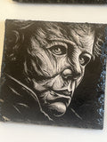 A square black slate stone coaster featuring a high-contrast black and white portrait of Michael Myers.