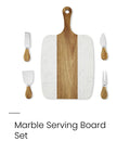Marble serving set includes a rectangular serving board with a white marble pattern and a natural wood center stripe, plus four serving utensiles 